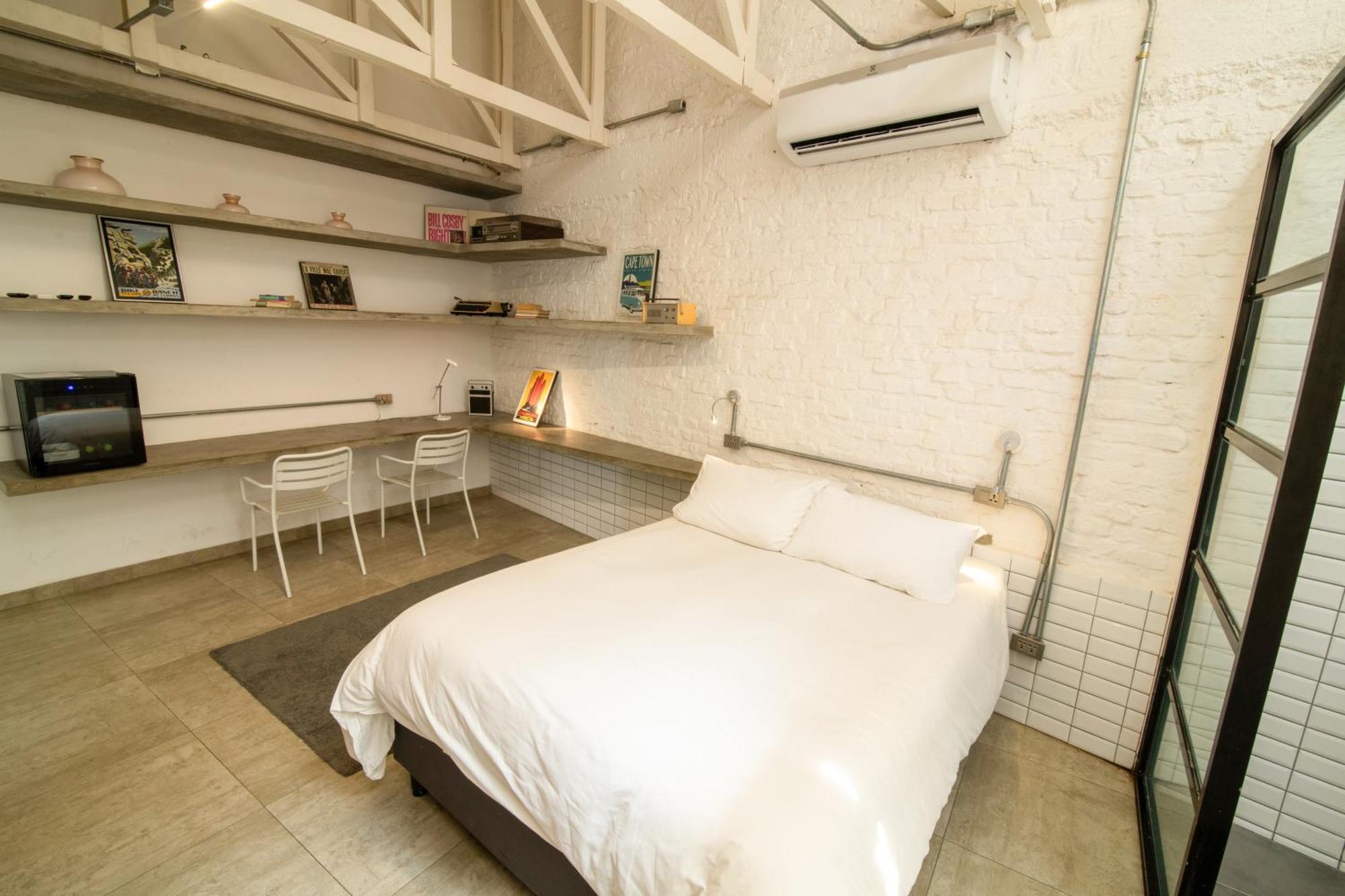 Cosmopolitano Hotel Boutique Santa Cruz de La Sierra Exterior photo A bedroom in a micro apartment